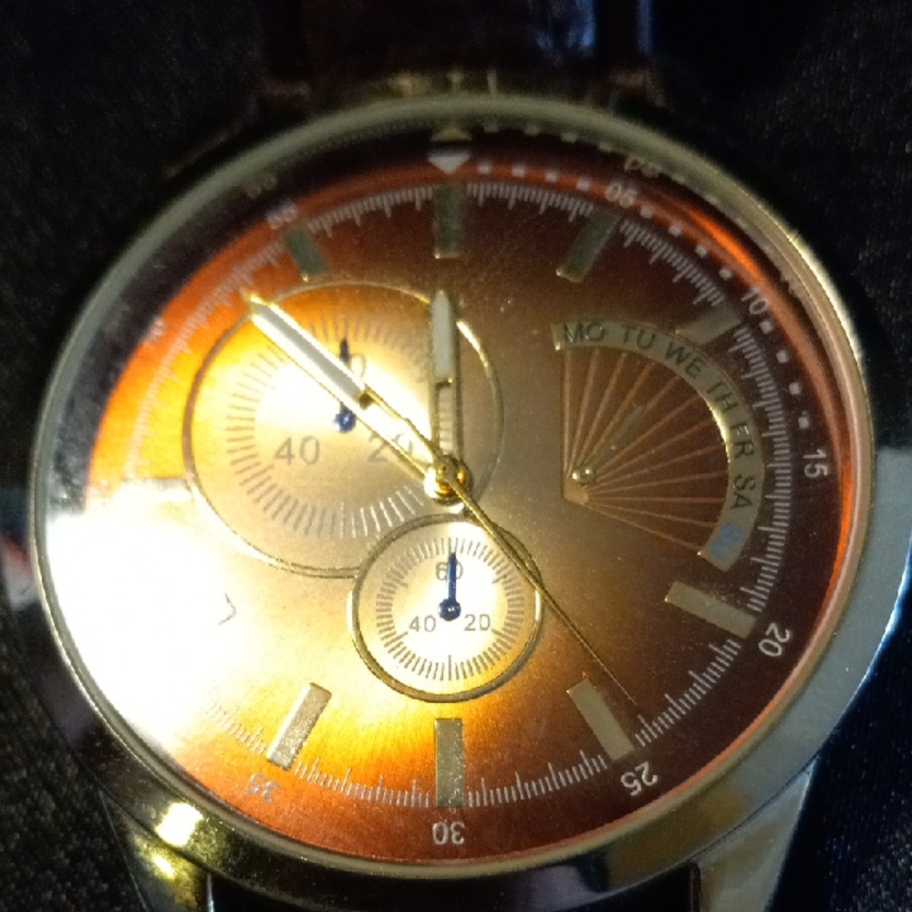 Vintage Merona designer Gold and Brown Watch and leather bracelet.